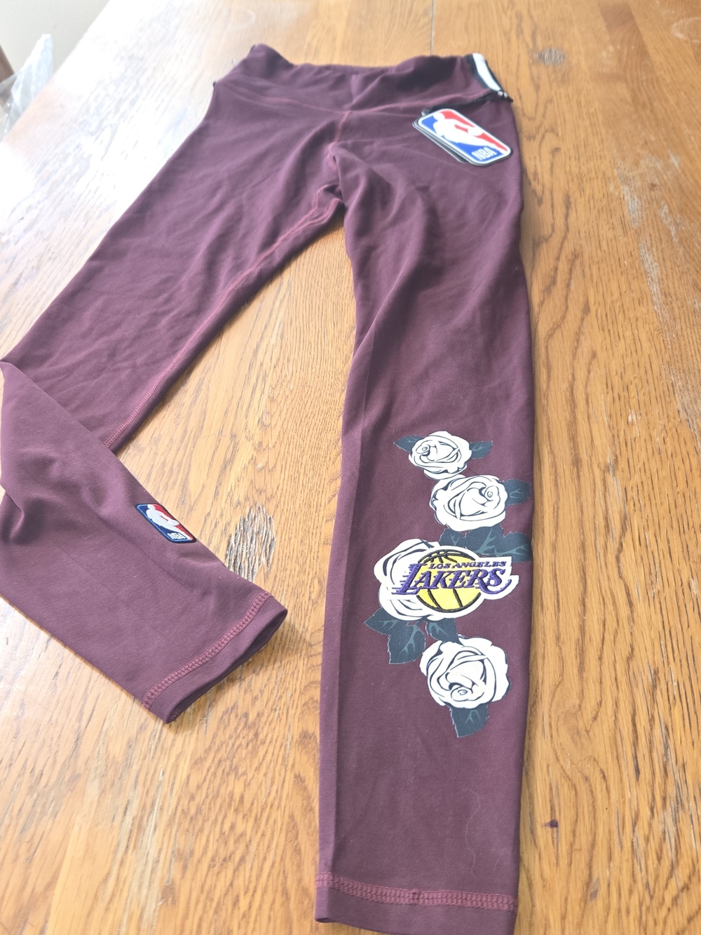 NWT. NBA Maroon Leggings with White Rose Graphics & Lakers Logo. Size XS. NNCP